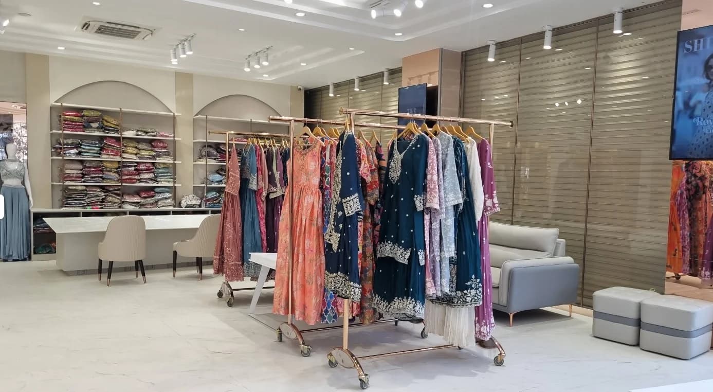 Designer ethnic wear dress collections on hangers